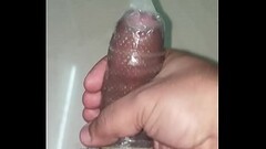 Indian man cums in a dotted condom Thumb